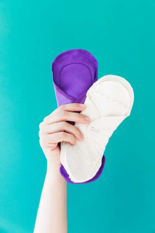 A Hand Brandishes Reusable Menstrual Pads Photo