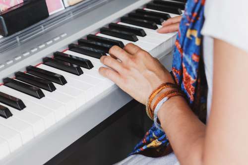 A Woman Plays The Piano Photo
