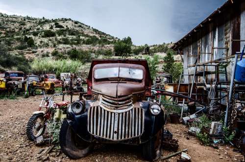 An Old Chevrolet In A Desert Graveyard Photo