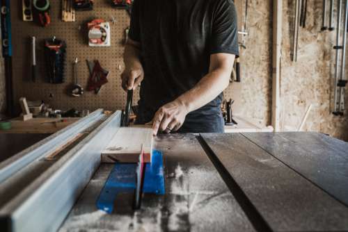Cutting Wood On Workbench Photo