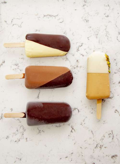 Ice-Creams Of Different Shades On A Marble Counter Photo