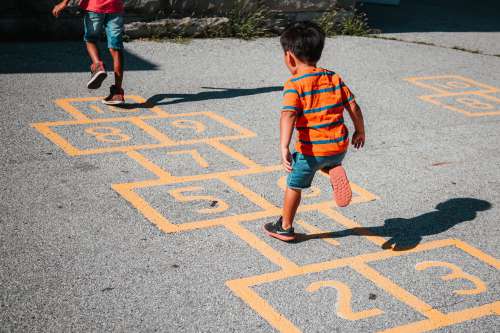 Playing Hopscotch Together Photo