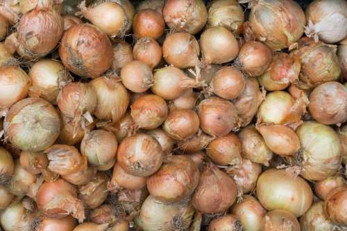 Full frame of onions on a market