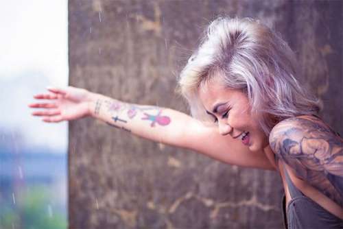 Smiling Woman With Tattoos Free Photo 