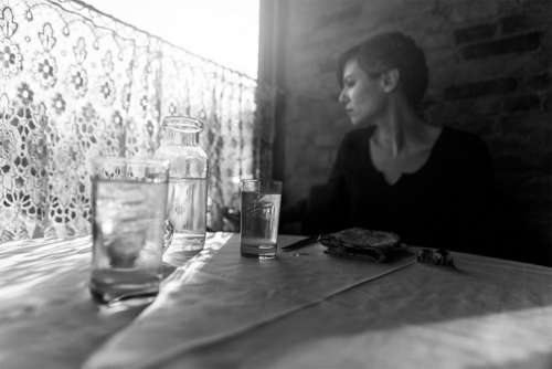 Lady in Restaurant Thinking Free Photo 