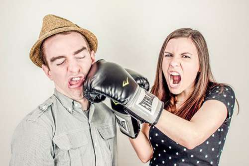 Woman Punching a Man Free Photo 