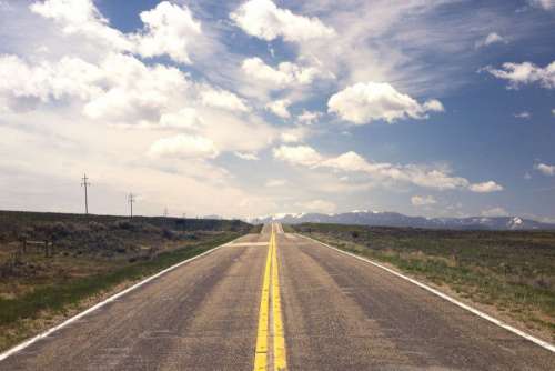 Lonely Road with Blue Sky Free Photo 