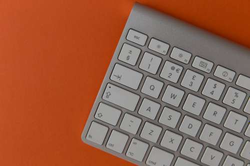 Keyboard On Orange Background