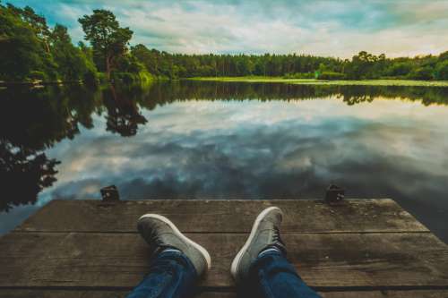 Man Relaxing At Lake