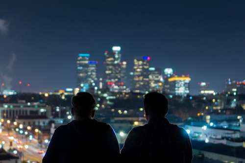 Men Viewing City