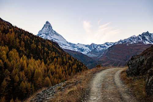 Mountain Path & Snowy Peaks