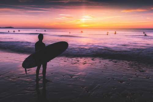 Surfer At Sunset