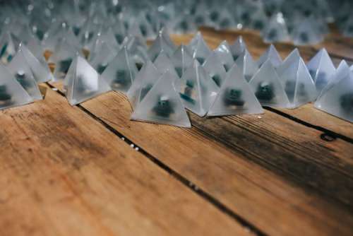 Little triangle lights on a wooden floor