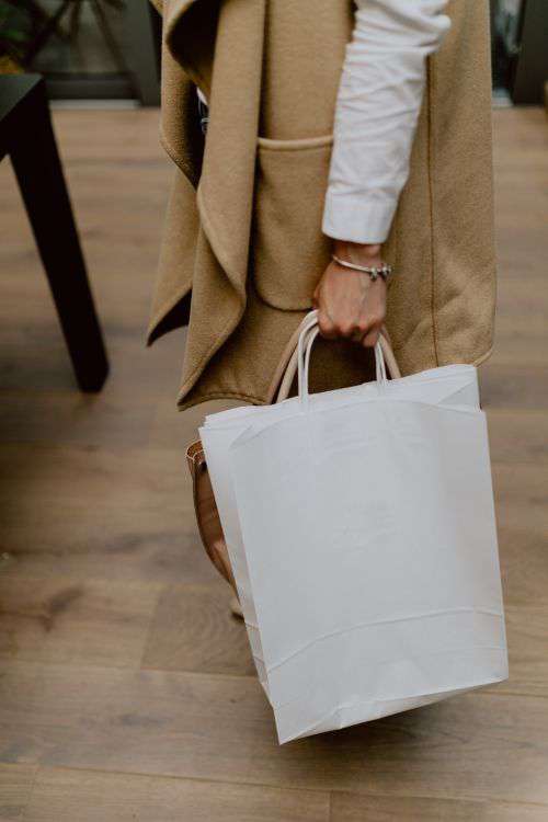 Woman with blank paper bag
