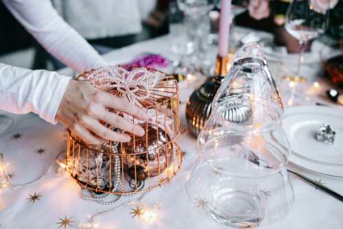 Hands Decorating Christmas Table