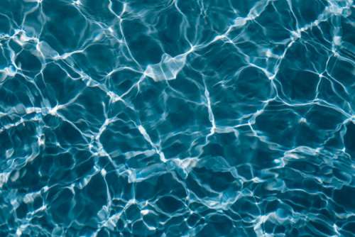 Wavy water surface in a swimming pool