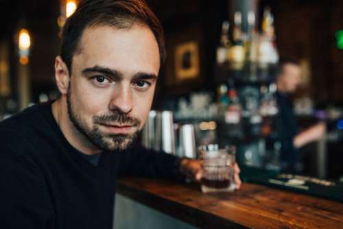 Handsome young man in a pub