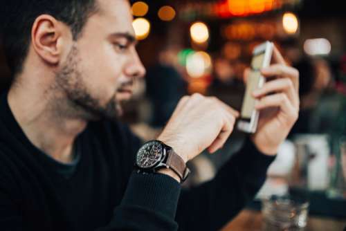 Young Entrepreneur Working from a Modern Cafe