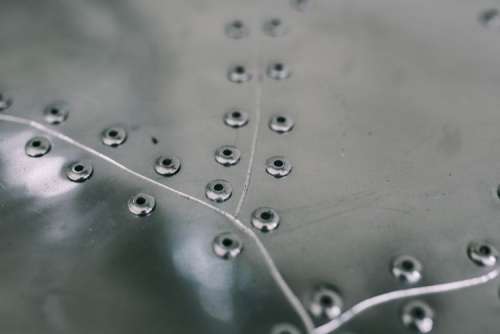 Metal plates with rivets seamless background