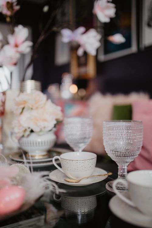 Porcelain and glass dishware on the glass table