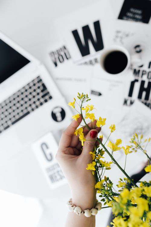 Workspace with yellow flowers