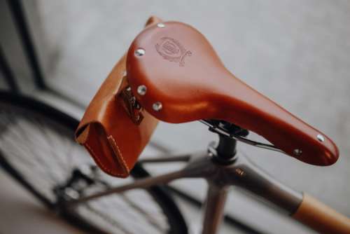 Brown leather saddle of bicycle