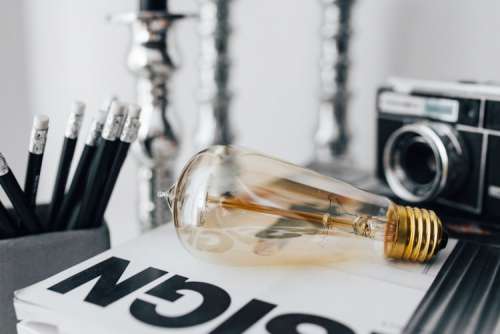 Pencils, magazines and an old lightbulb