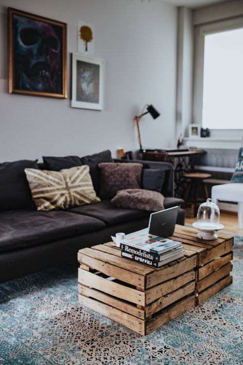 Designer living room interior with a wooden box table and a light blue carpet