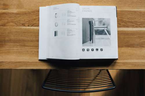 Tap catalogue on a wooden table