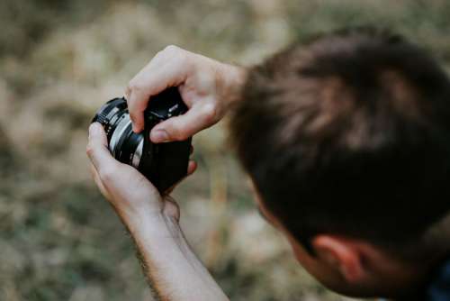 Photographer taking photos of a beautiful, young woman