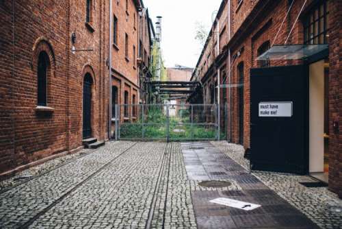 By the entrance to the gallery in the abandoned factory