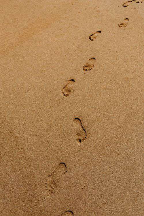 Footprints on a sandy beach, Portugal