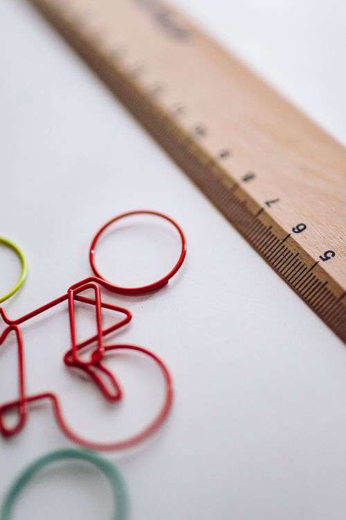 Bicycle paper clips and a wooden ruler