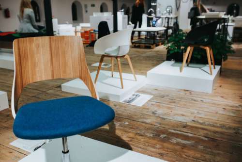 Various designer chairs and tables on an exhibition