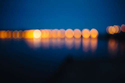 City lights reflected in the water at night