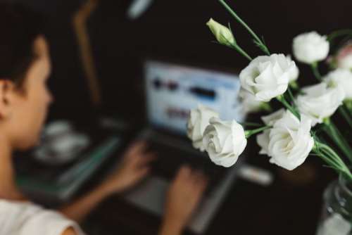 Woman working on laptop at home office