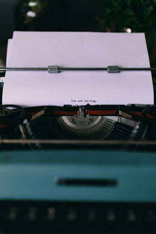 Closeup view of typing quotes on the old typewriter