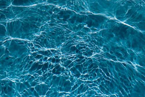 Wavy water surface in a swimming pool