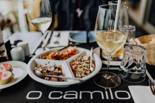 Dishes with various seafood at dinner table, O Camilo Restaurant, Portugal