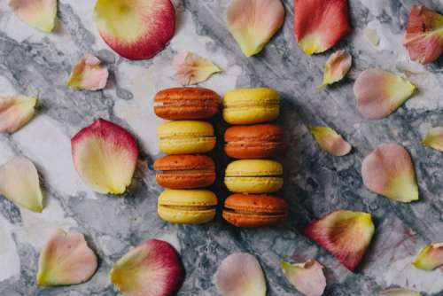 Overhead view of macarons on a marble slab