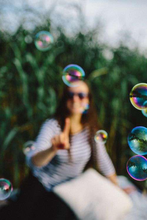 Having fun with soap bubbles in the nature