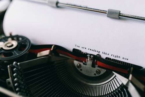 Closeup view of typing quotes on the old typewriter