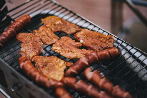 Pork and sausage on the grill