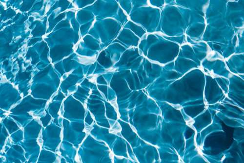 Wavy water surface in a swimming pool