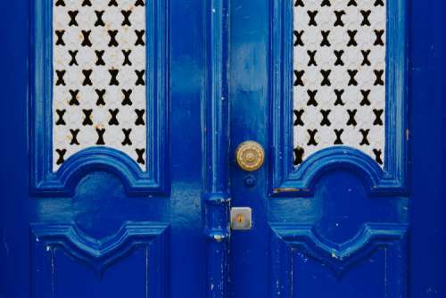 Colorful wooden door in the facade of a typical Portuguese house at Lisbon, Portugal