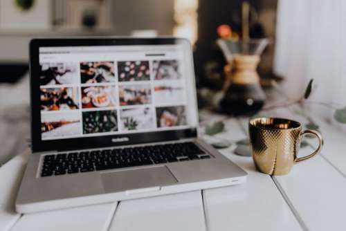 Apple MacBook & Coffee on the white desk