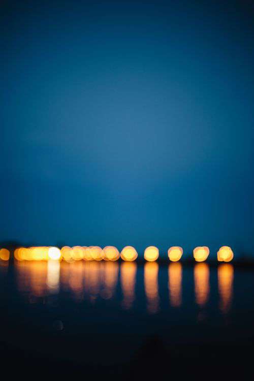 City lights reflected in the water at night