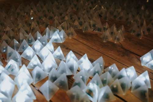 Little triangle lights on a wooden floor