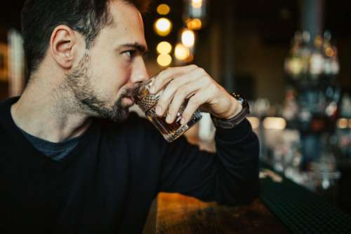 Handsome young man in a pub