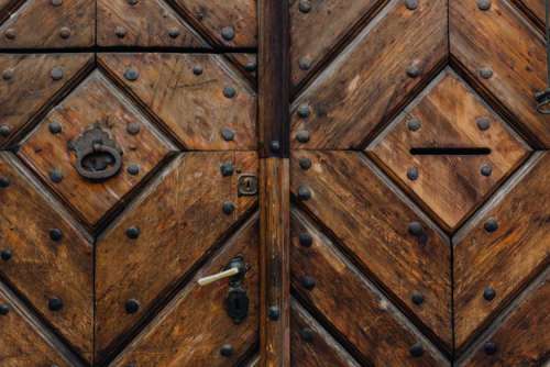 Intricately ornamented doors with sculpted rappers